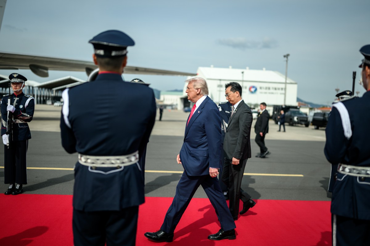 President Donald Trump greets officials before boarding Air Force One at Gimhae International Airport in Busan, South Korea on Thursday, October 30, 2025. (Official White House Photo by Daniel Torok)