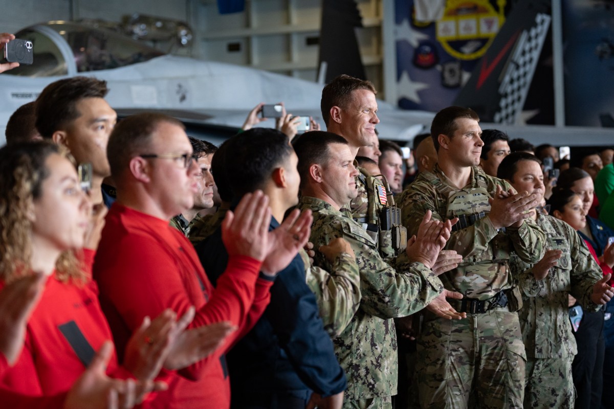 US President Donald Trump and First Lady Melania Trump greets sailors during a visit to the USS George H.W. Bush aircraft carrier which is out at sea near Norfolk, Virginia, October 5, 2025, as they travel to see a Naval demonstration as part of the US Navy's 250th anniversary celebration, "America's Navy 250: Titans of the Sea - A Salute to the Fleet". (Official White House Photo by Andrea Hanks)