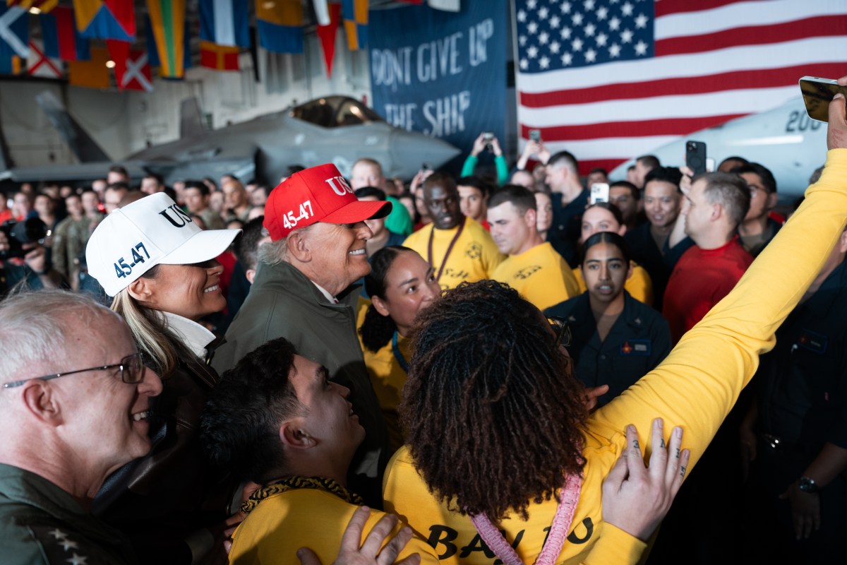 President Donald Trump and First Lady Melania Trump pose for photos with U.S. Navy sailors stationed aboard the aircraft carrier USS George H.W. Bush, Sunday, October 5, 2025, in Norfolk, Virginia. (Official White House Photo by Andrea Hanks)