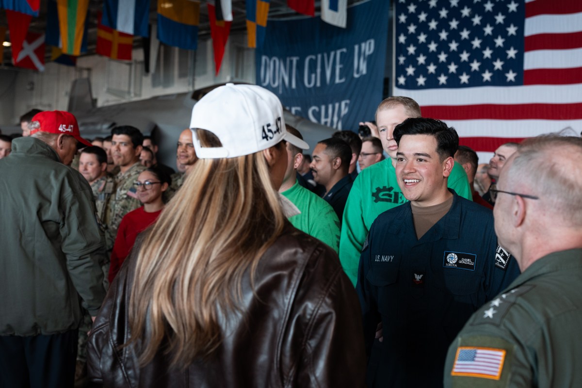 President Donald Trump and First Lady Melania Trump speak with U.S. Navy sailors stationed aboard the aircraft carrier USS George H.W. Bush after posing for photos, Sunday, October 5, 2025, in Norfolk, Virginia. (Official White House Photo by Andrea Hanks)