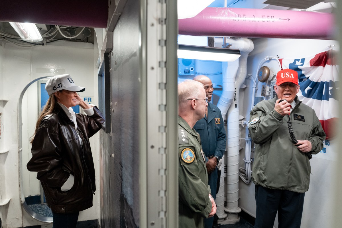 President Donald Trump and First Lady Melania Trump tours the aircraft carrier USS George H.W. Bush with Rear Adm. Alexis "Lex" Walker before viewing a naval sea power demonstration where President Trump speaks to sailors aboard the ship from a microphone Sunday, October 5, 2025. (Official White House Photo by Andrea Hanks)