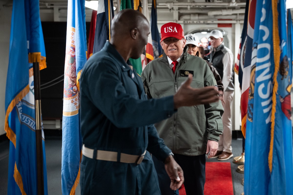 President Donald Trump and First Lady Melania Trump tours the aircraft carrier USS George H.W. Bush with Rear Adm. Alexis "Lex" Walker before viewing a naval sea power demonstration, Sunday, October 5, 2025. (Official White House Photo by Andrea Hanks)