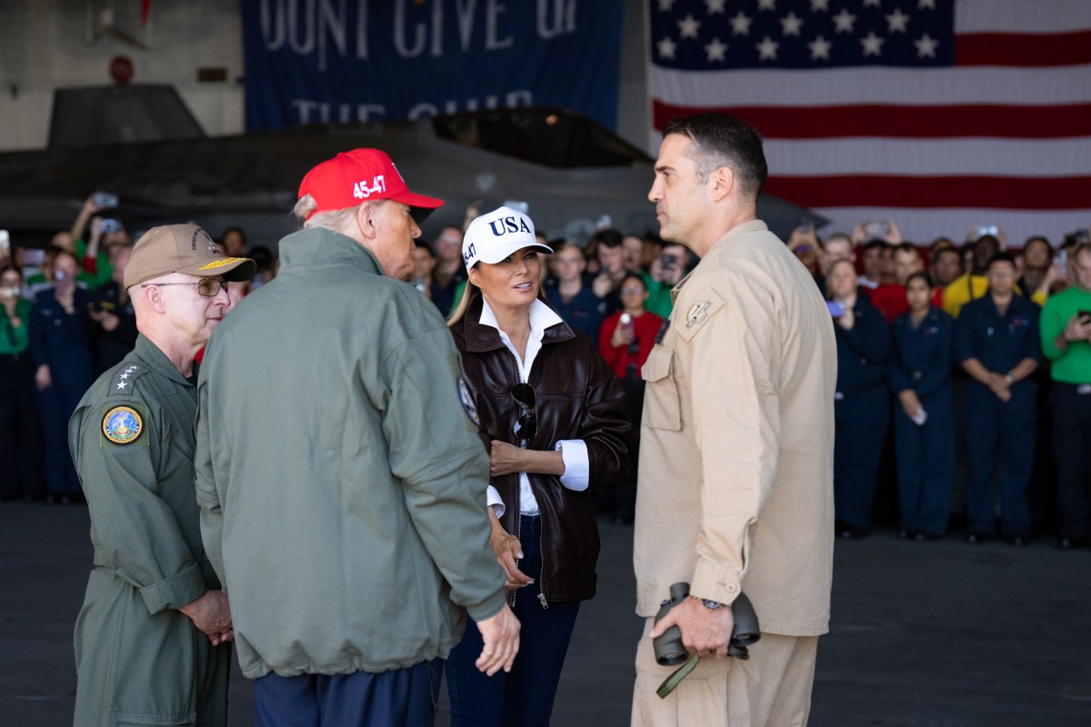 President Donald Trump and First Lady Melania Trump are escorted to the Crows Nest aboard the USS George H.W. Bush to watch the Naval Sea Power Demonstration in honor of the 250th anniversary of the U.S. Navy, Sunday, October 5, 2025. (Official White House Photo by Andrea Hanks)