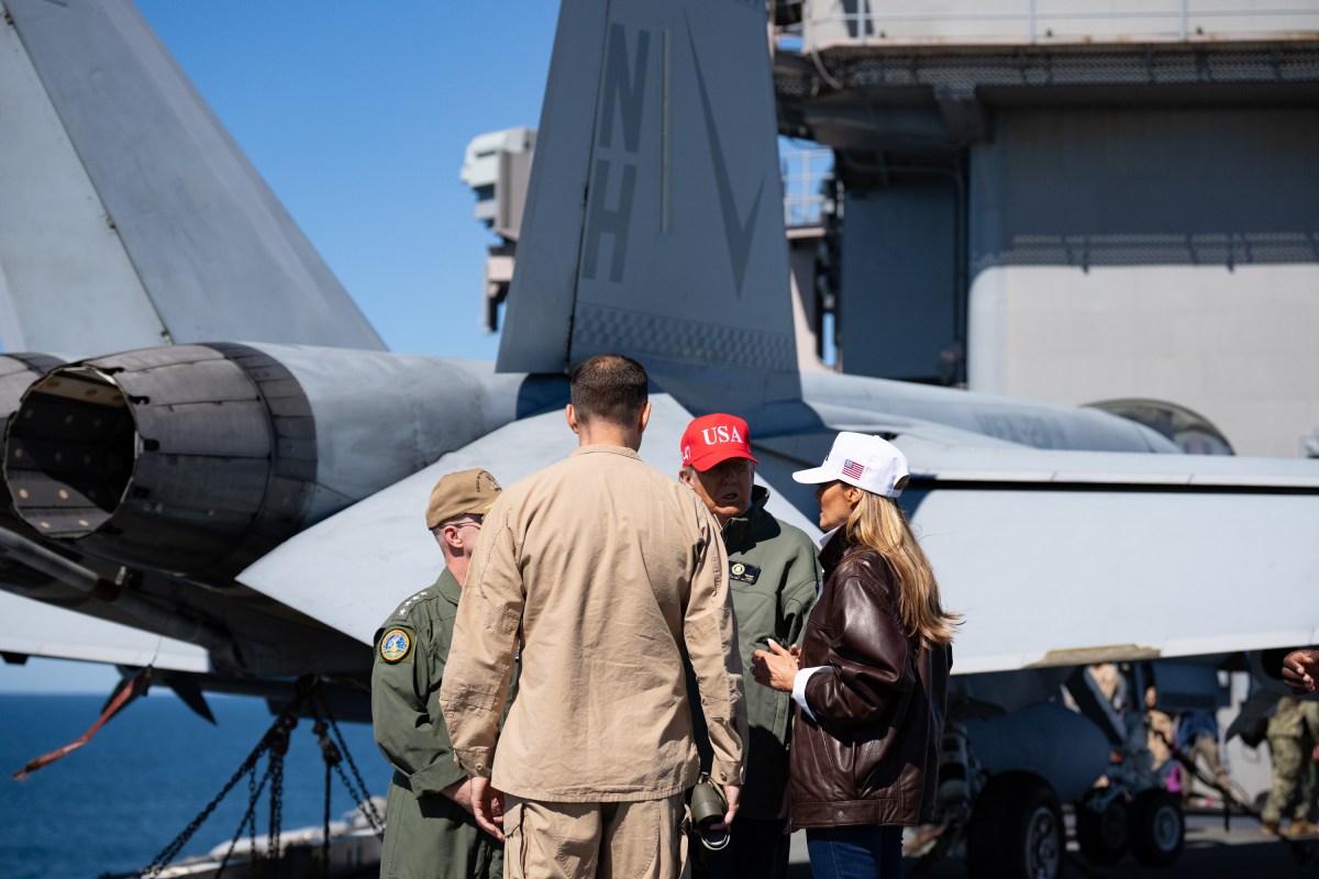 President Donald Trump and First Lady Melania Trump speak with Chief of Naval Operations Admiral Daryl Caudle and others during naval sea power demonstrations in honor of the 250th anniversary of the U.S. Navy, Sunday, October 5, 2025, aboard the USS George H.W. Bush in the Atlantic Ocean off the coast of Norfolk, Virginia. (Official White House Photo by Andrea Hanks)