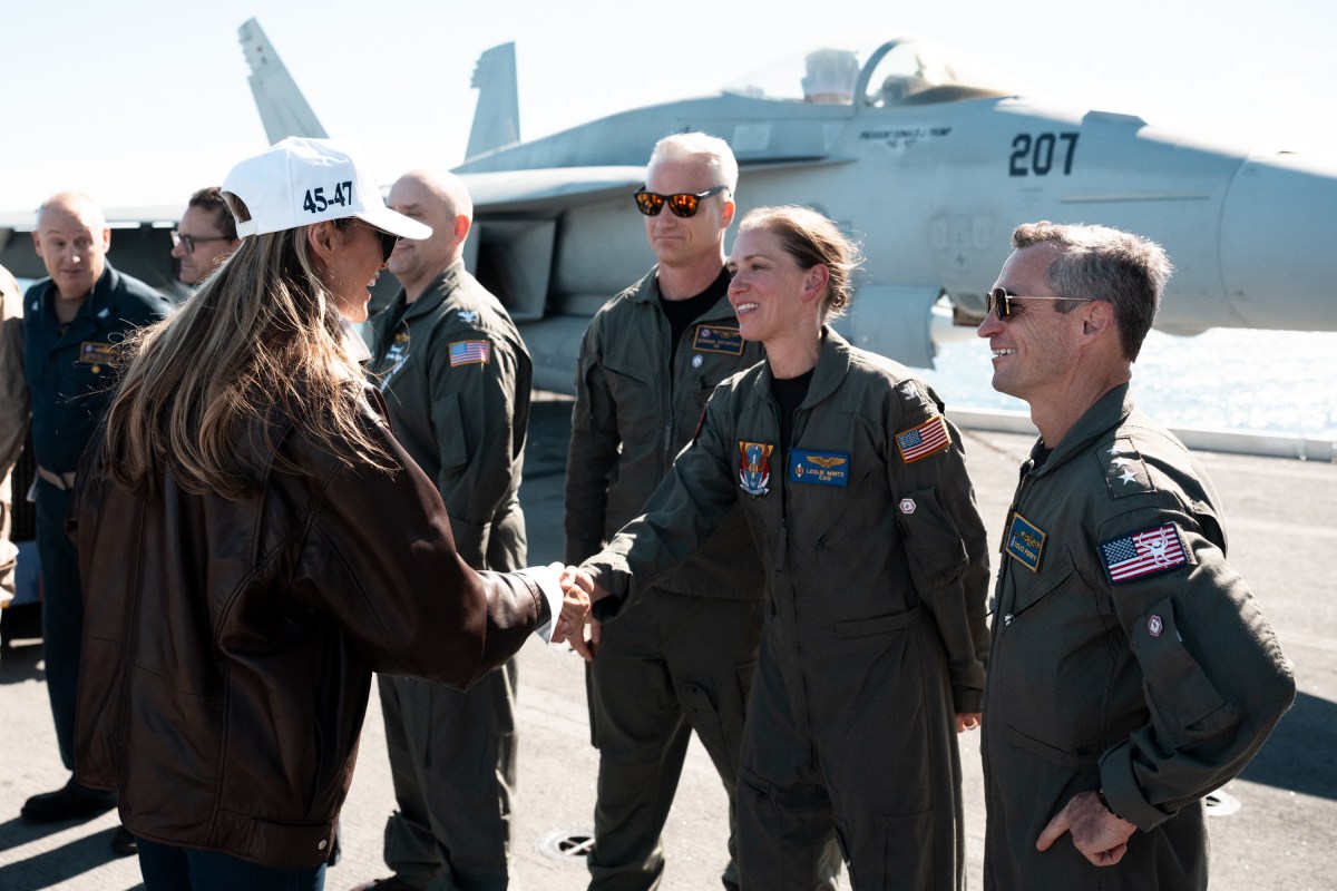 President Donald Trump and First Lady Melania Trump speak with sailors after stationed aboard the USS George H.W. Bush after naval sea power demonstrations in honor of the 250th anniversary of the U.S. Navy, Sunday, October 5, 2025, in the Atlantic Ocean off the coast of Norfolk, Virginia. (Official White House Photo by Andrea Hanks)