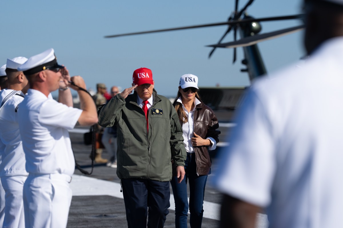 President Donald Trump and First Lady Melania Trump arrive at the USS Harry S. Truman on Pier 14 at Naval Station Norfolk on Sunday, Oct. 5, 2025 during an event celebrating the 250th anniversary of the United States Navy.  (Official White House Photo by Andrea Hanks)