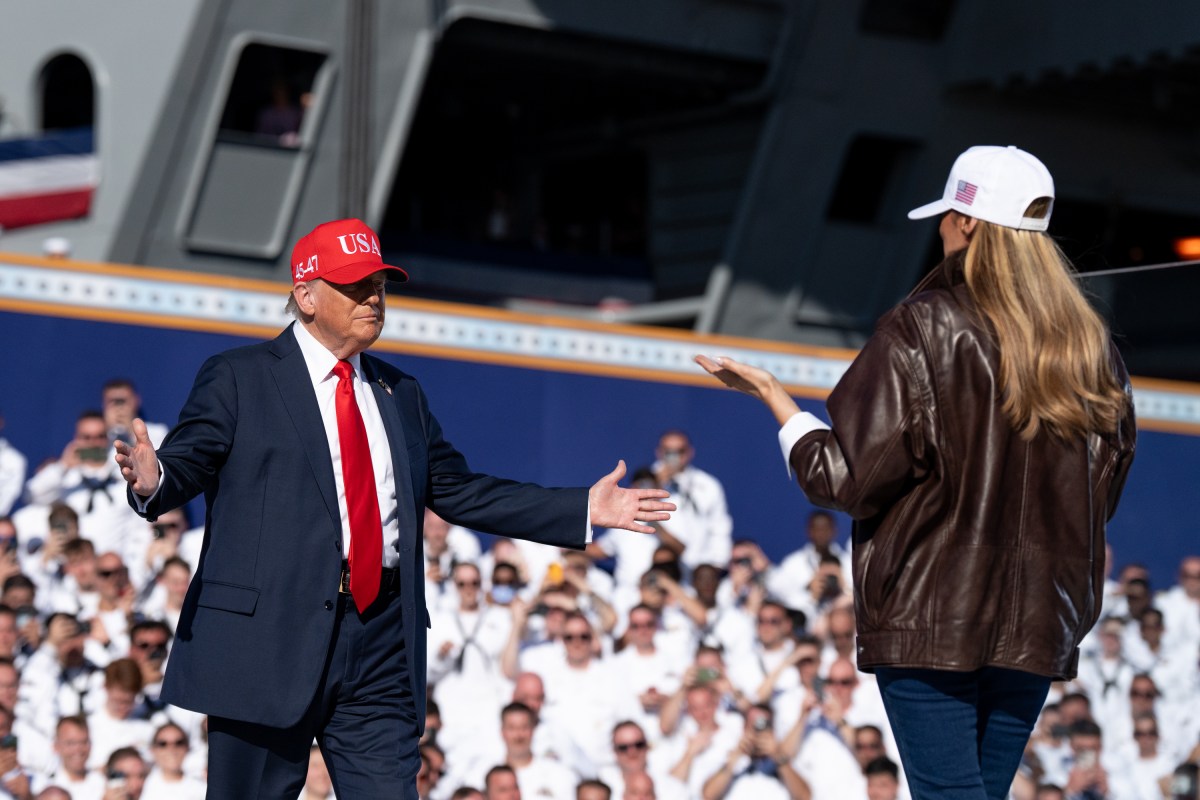 First Lady Melania Trump and U.S. President Donald Trump embrace as he takes the stage to make remarks during the Navy 250 Celebration aboard the USS Harry S. Truman aircraft carrier on October 5, 2025 in Norfolk, Virginia. President Trump is visiting Naval Station Norfolk in Virginia for a celebration of the 250th birthday of the U.S. Navy. (Official White House Photo by Andrea Hanks)