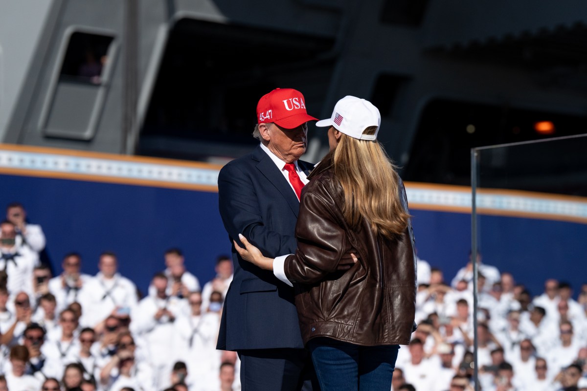 First Lady Melania Trump and U.S. President Donald Trump embrace as he takes the stage to make remarks during the Navy 250 Celebration aboard the USS Harry S. Truman aircraft carrier on October 5, 2025 in Norfolk, Virginia. President Trump is visiting Naval Station Norfolk in Virginia for a celebration of the 250th birthday of the U.S. Navy. (Official White House Photo by Andrea Hanks)