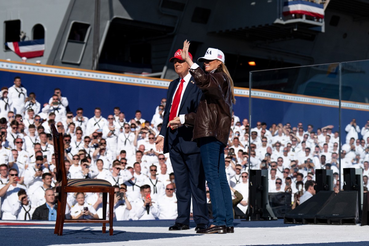 US President Donald Trump and US First Lady Melania Trump walk onstage to deliver remarks during a visit to the USS Harry S. Truman during the US Navy's 250th anniversary celebration, "America's Navy 250: Titans of the Sea - A Salute to the Fleet", at Naval Station Norfolk Pier 14 in Norfolk, Virginia on October 5, 2025. (Official White House Photo by Andrea Hanks)