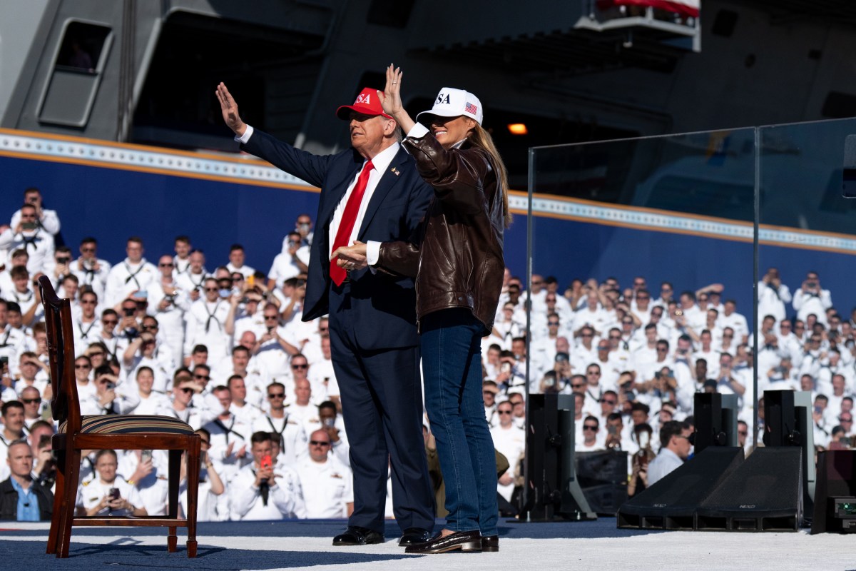 US President Donald Trump and US First Lady Melania Trump walk onstage to deliver remarks during a visit to the USS Harry S. Truman during the US Navy's 250th anniversary celebration, "America's Navy 250: Titans of the Sea - A Salute to the Fleet", at Naval Station Norfolk Pier 14 in Norfolk, Virginia on October 5, 2025. (Official White House Photo by Andrea Hanks)