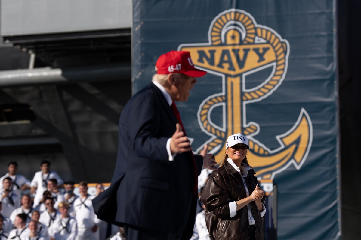 US President Donald Trump and US First Lady Melania Trump walk onstage to deliver remarks during a visit to the USS Harry S. Truman during the US Navy's 250th anniversary celebration, "America's Navy 250: Titans of the Sea - A Salute to the Fleet", at Naval Station Norfolk Pier 14 in Norfolk, Virginia on October 5, 2025. (Official White House Photo by Andrea Hanks)