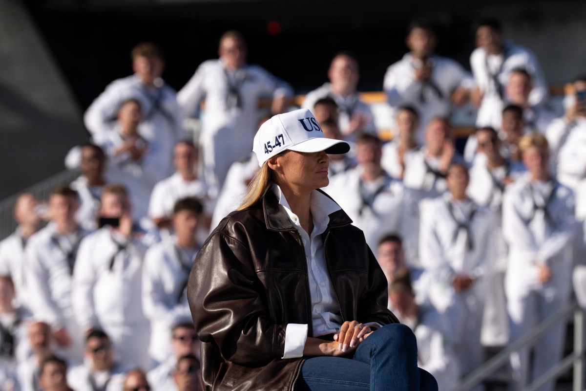 First Lady Melania Trump and U.S. President Donald Trump embrace as he takes the stage to make remarks during the Navy 250 Celebration aboard the USS Harry S. Truman aircraft carrier on October 5, 2025 in Norfolk, Virginia. President Trump is visiting Naval Station Norfolk in Virginia for a celebration of the 250th birthday of the U.S. Navy. (Official White House Photo by Andrea Hanks)