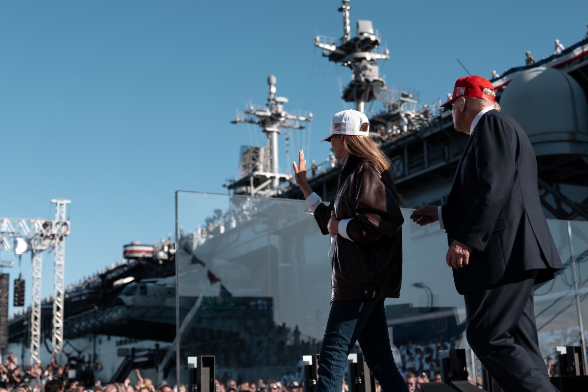 US President Donald Trump and US First Lady Melania Trump wave after delivering remarks during the US Navy's 250th anniversary celebration, "America's Navy 250: Titans of the Sea - A Salute to the Fleet", at Naval Station Norfolk Pier 14 in Norfolk, Virginia on October 5, 2025. (Official White House Photo by Andrea Hanks)