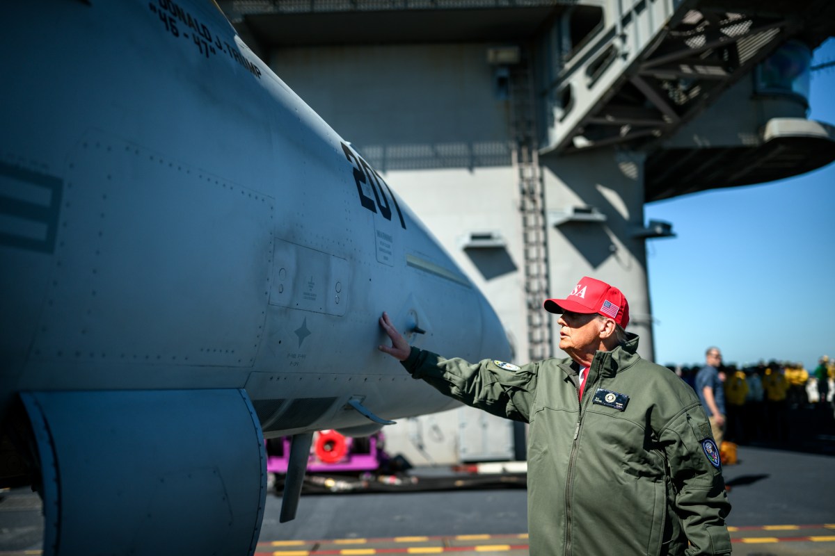 President Donald Trump and First Lady Melania Trump tours the aircraft carrier USS George H.W. Bush with Rear Adm. Alexis "Lex" Walker before viewing a naval sea power demonstration, Sunday, October 5, 2025. (Official White House Photo by Daniel Torok)