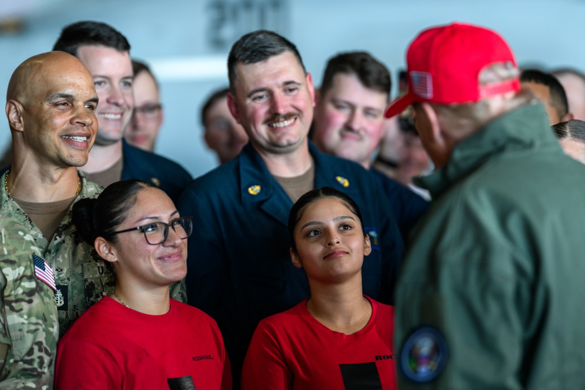 President Donald Trump and First Lady Melania Trump greet U.S. Navy sailors stationed aboard the aircraft carrier USS George H.W. Bush, Sunday, October 5, 2025, in Norfolk, Virginia. (Official White House Photo by Daniel Torok)