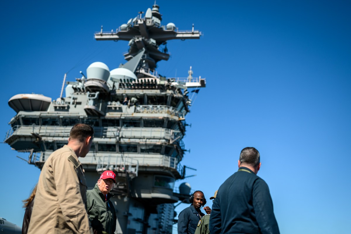 President Donald Trump and First Lady Melania Trump speak with Chief of Naval Operations Admiral Daryl Caudle and others during naval sea power demonstrations in honor of the 250th anniversary of the U.S. Navy, Sunday, October 5, 2025, aboard the USS George H.W. Bush in the Atlantic Ocean off the coast of Norfolk, Virginia. (Official White House Photo by Daniel Torok)