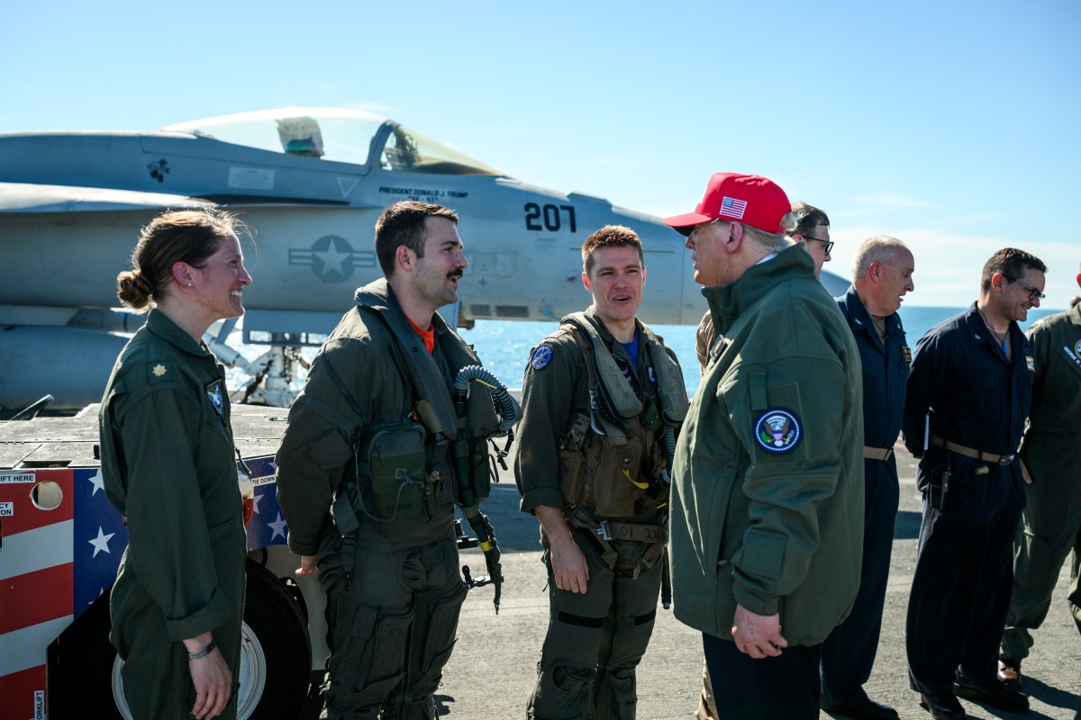 President Donald Trump and First Lady Melania Trump speak to sailors after a naval sea power demonstration, Sunday, October 5, 2025, aboard the USS George H.W. Bush in the Atlantic Ocean off the coast of Norfolk, Virginia. (Official White House Photo by Daniel Torok)