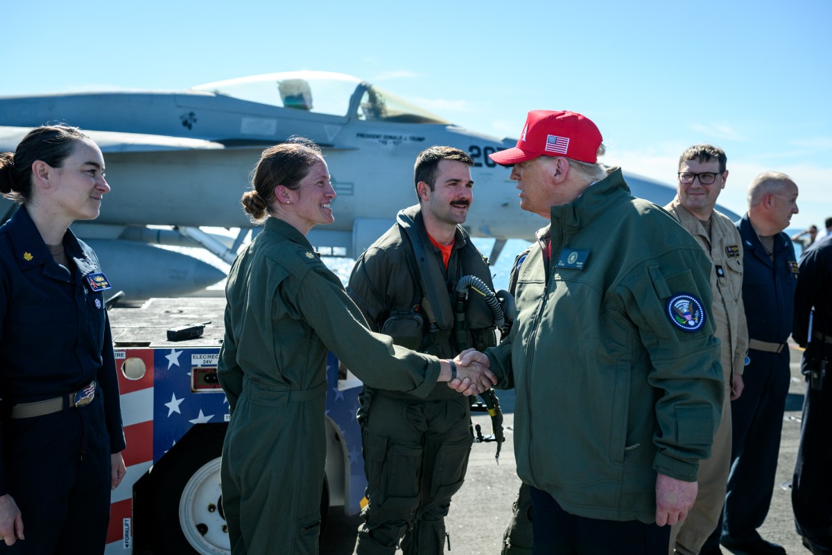 President Donald Trump and First Lady Melania Trump speak to sailors after a naval sea power demonstration, Sunday, October 5, 2025, aboard the USS George H.W. Bush in the Atlantic Ocean off the coast of Norfolk, Virginia. (Official White House Photo by Daniel Torok)