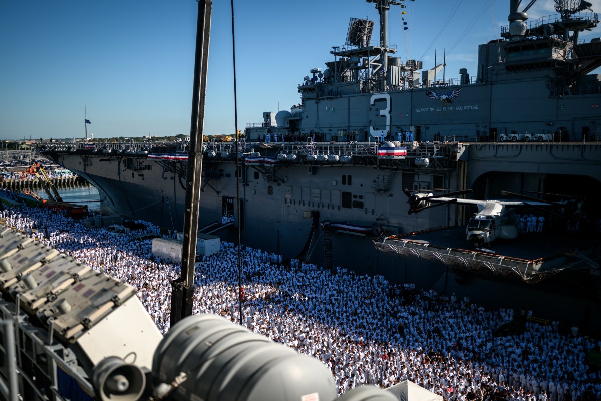 U.S. Navy sailors gather to watch President Donald Trump deliver remarks at the U.S. Navy 250th anniversary celebration at Naval Station Norfolk in Norfolk, Virginia, Sunday, October 5, 2025. (Official White House Photo by Daniel Torok)