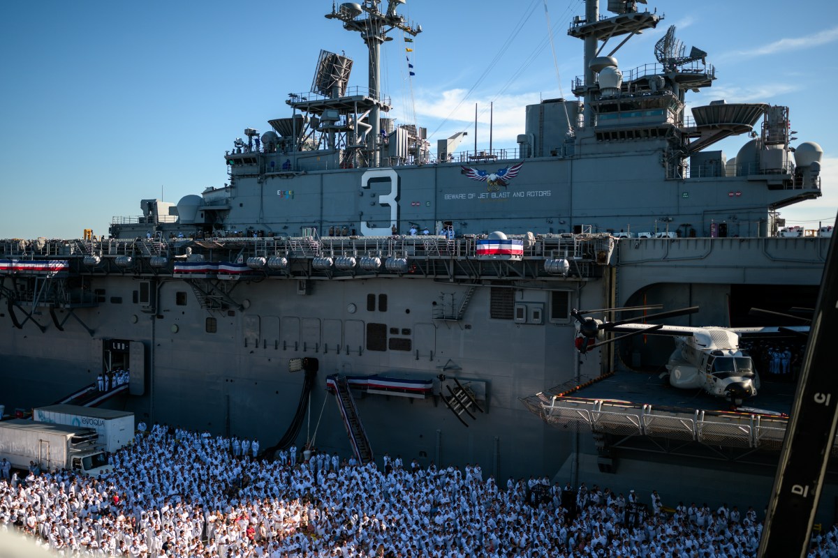 U.S. Navy sailors gather to watch President Donald Trump deliver remarks at the U.S. Navy 250th anniversary celebration at Naval Station Norfolk in Norfolk, Virginia, Sunday, October 5, 2025. (Official White House Photo by Daniel Torok)