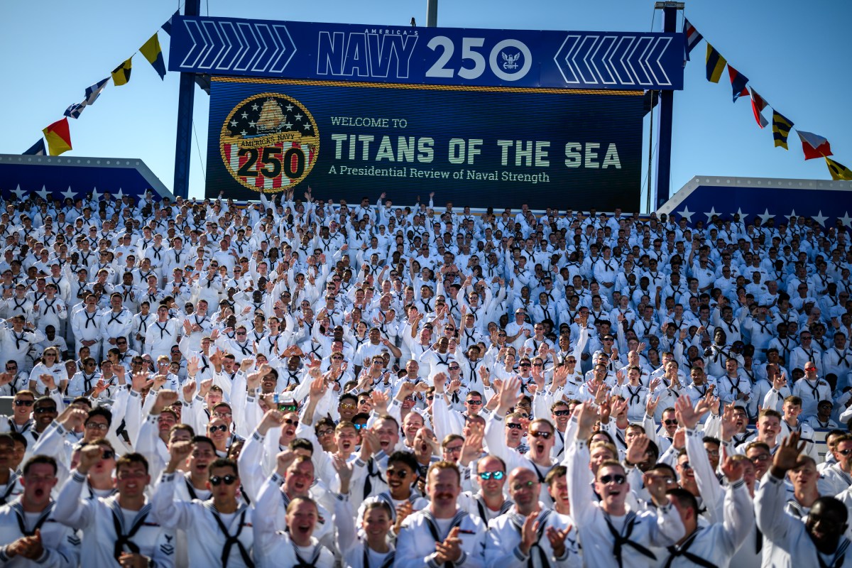 U.S. Navy sailors cheer before President Donald Trump delivers remarks in honor of the U.S. Navy 250th anniversary celebration at the USS Harry S. Truman aircraft carrier at Naval Station Norfolk in Norfolk, Virginia. (Official White House Photo by Daniel Torok)