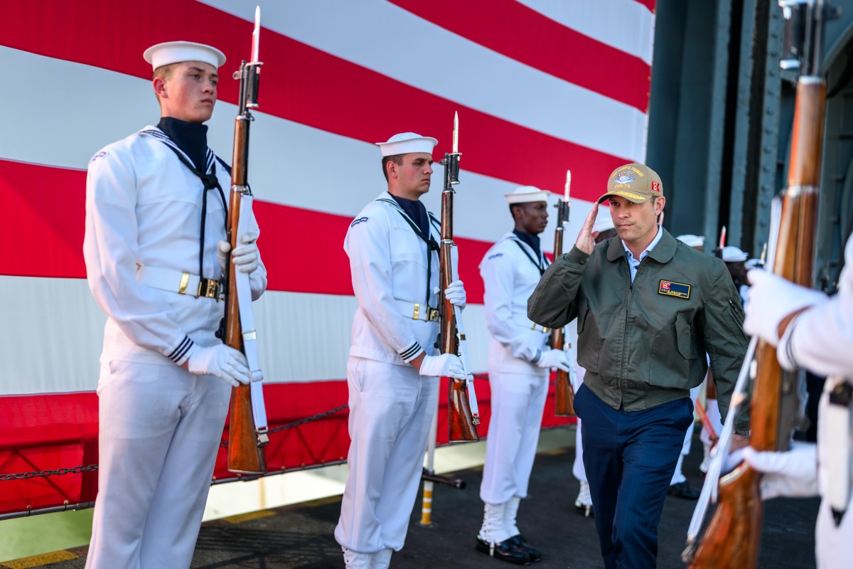 Secretary of War Pete Hegseth walks towards the stage to deliver remarks in honor of the U.S. Navy 250th anniversary celebration at the USS Harry S. Truman aircraft carrier at Naval Station Norfolk in Norfolk, Virginia. (Official White House Photo by Daniel Torok)