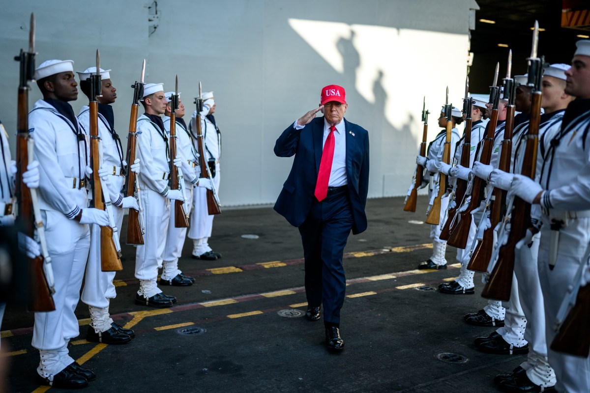 President Donald Trump salutes sailors as he walks toward the stage to deliver remarks in honor of the U.S. Navy 250th anniversary celebration at the USS Harry S. Truman aircraft carrier at Naval Station Norfolk in Norfolk, Virginia. (Official White House Photo by Daniel Torok)