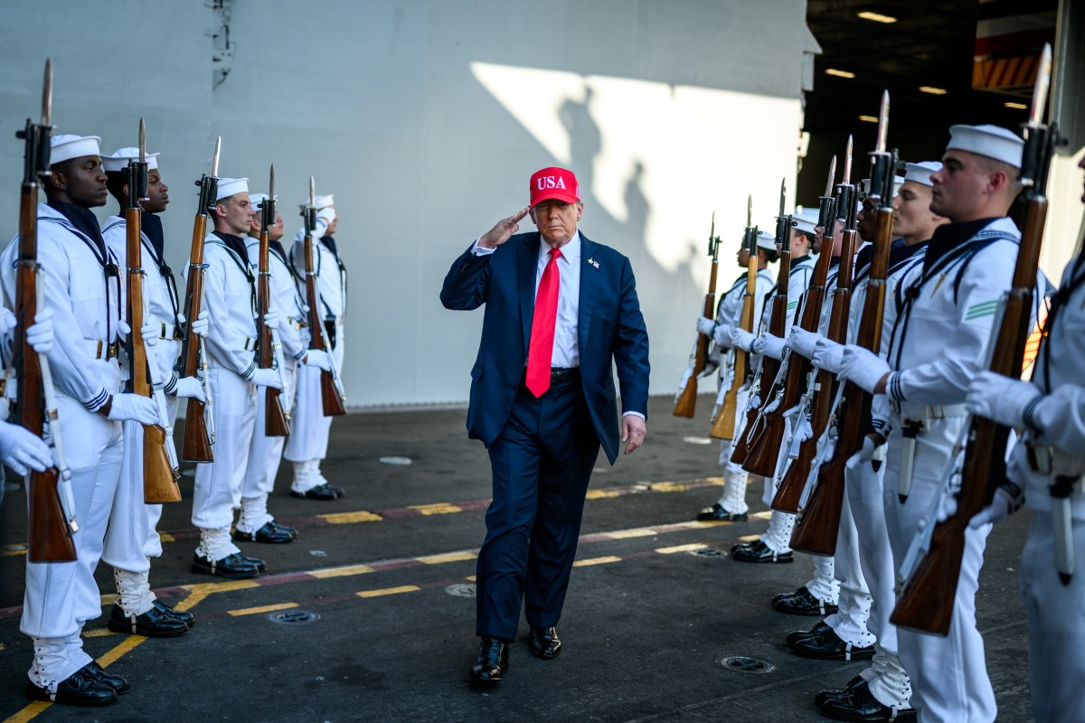 President Donald Trump salutes sailors as he walks toward the stage to deliver remarks in honor of the U.S. Navy 250th anniversary celebration at the USS Harry S. Truman aircraft carrier at Naval Station Norfolk in Norfolk, Virginia. (Official White House Photo by Daniel Torok)