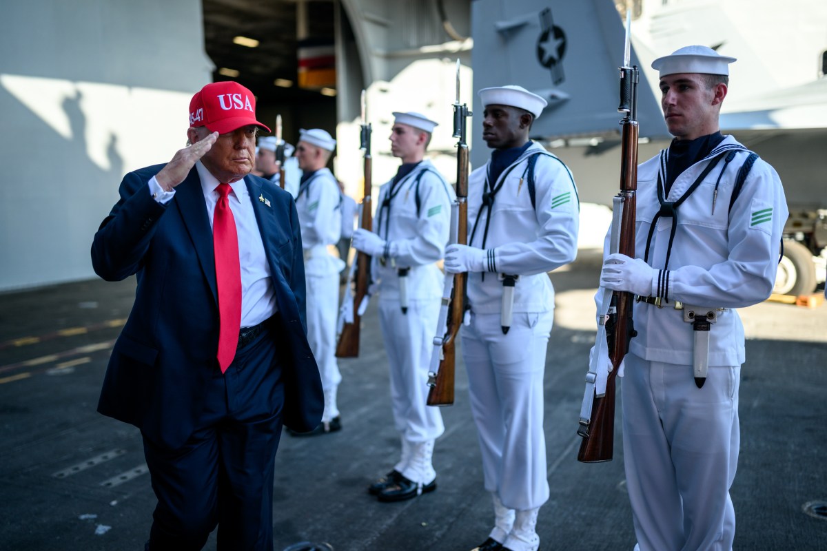 President Donald Trump salutes sailors as he walks toward the stage to deliver remarks in honor of the U.S. Navy 250th anniversary celebration at the USS Harry S. Truman aircraft carrier at Naval Station Norfolk in Norfolk, Virginia. (Official White House Photo by Daniel Torok)