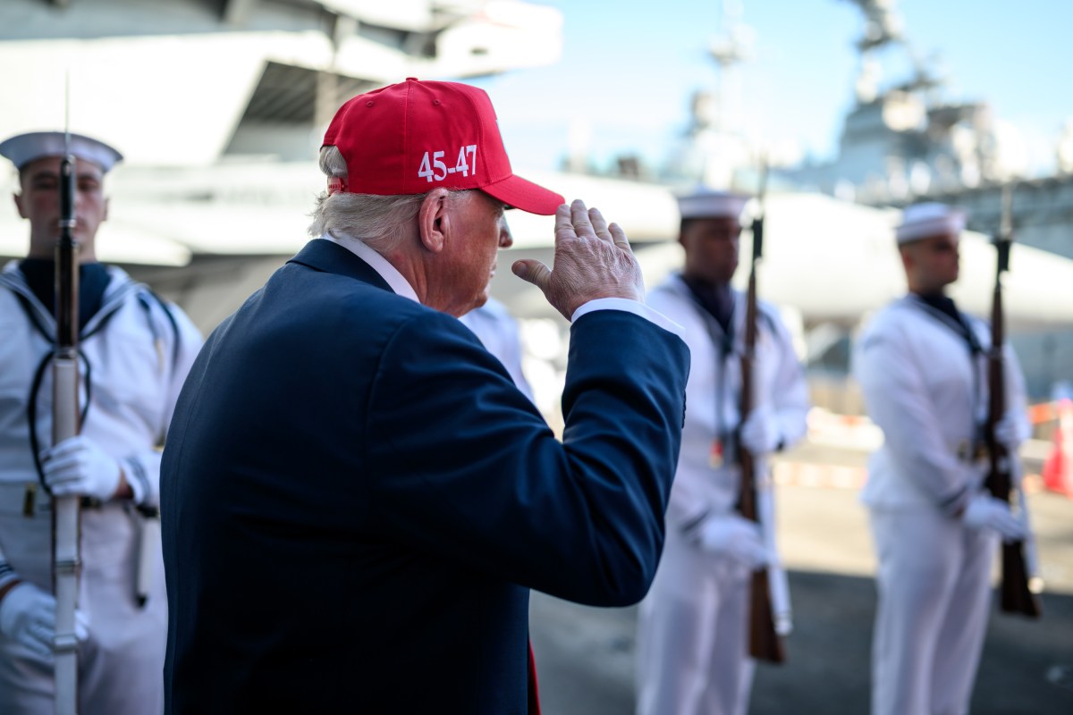 President Donald Trump salutes sailors as he walks toward the stage to deliver remarks in honor of the U.S. Navy 250th anniversary celebration at the USS Harry S. Truman aircraft carrier at Naval Station Norfolk in Norfolk, Virginia. (Official White House Photo by Daniel Torok)
