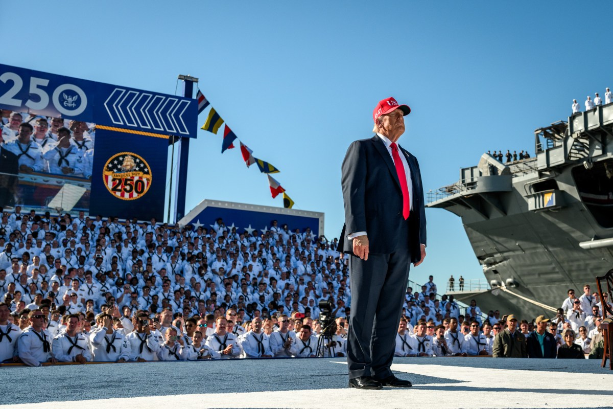President Donald Trump gestures to the crowd after arriving on stage to deliver remarks in honor of the U.S. Navy 250th anniversary celebration at the USS Harry S. Truman aircraft carrier at Naval Station Norfolk in Norfolk, Virginia. (Official White House Photo by Daniel Torok)