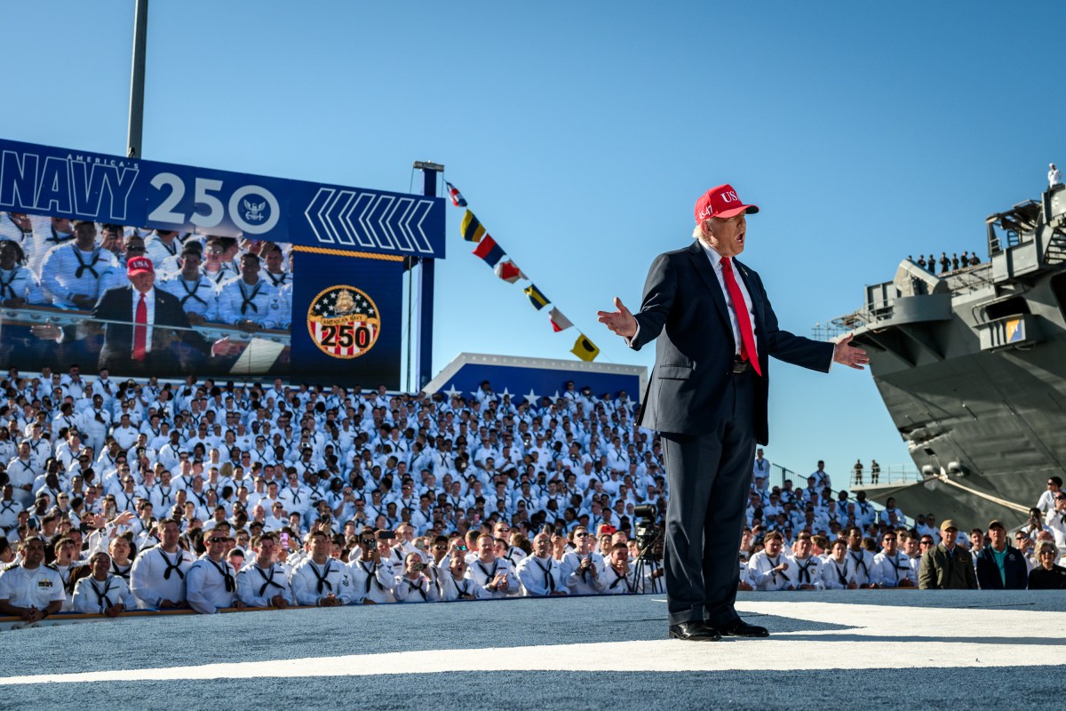 President Donald Trump gestures to the crowd after arriving on stage to deliver remarks in honor of the U.S. Navy 250th anniversary celebration at the USS Harry S. Truman aircraft carrier at Naval Station Norfolk in Norfolk, Virginia. (Official White House Photo by Daniel Torok)