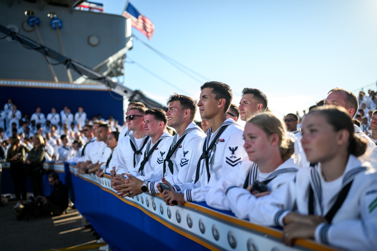 U.S. Navy sailors look on as President Donald Trump delivers remarks in honor of the U.S. Navy 250th anniversary celebration at the USS Harry S. Truman aircraft carrier at Naval Station Norfolk in Norfolk, Virginia. (Official White House Photo by Daniel Torok)