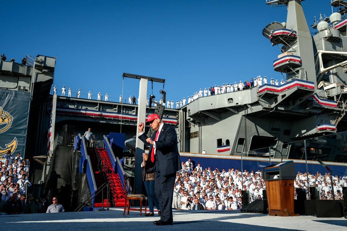 President Donald Trump gestures to the crowd after delivering remarks in honor of the U.S. Navy 250th anniversary celebration at the USS Harry S. Truman aircraft carrier at Naval Station Norfolk in Norfolk, Virginia. (Official White House Photo by Daniel Torok)