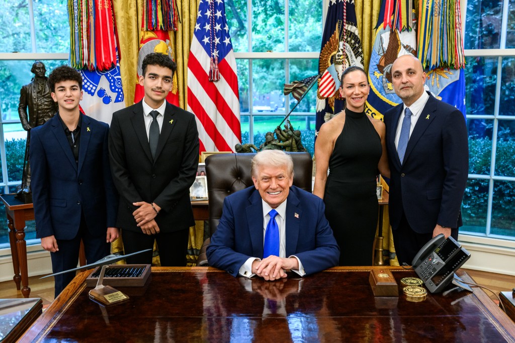 President Donald Trump meets with freed American-Israeli hostage Edan Alexander and others to mark the second anniversary of the Hamas-led terror attacks on Israel, Tuesday, October 7, 2025, in the Oval Office. (Official White House Photo by Daniel Torok)