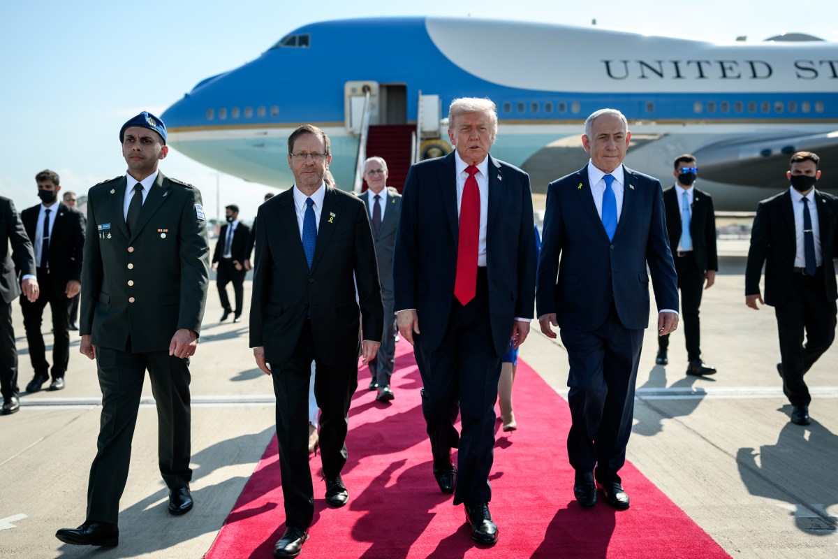 President Donald Trump is greeted by Israeli Prime Minister Benjamin Netanyahu and others after disembarking Air Force One at Ben Gurion International Airport in Israel, Monday, October 13, 2025, to celebrate the U.S.-brokered ceasefire and hostage release agreement between Israel and Hamas. (Official White House Photo by Daniel Torok)