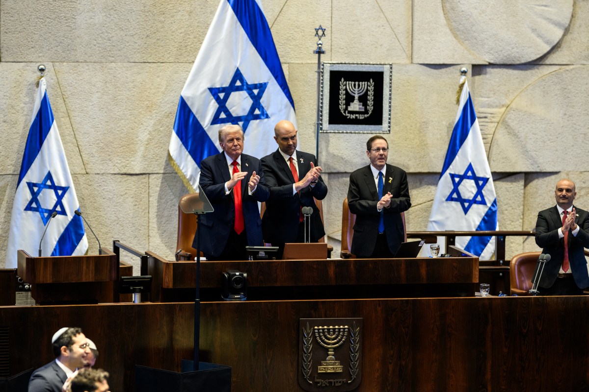 President Donald Trump receives a standing ovation before delivering remarks to the Knesset in Jerusalem, Israel, Monday, October 13, 2025, during a visit to celebrate the U.S.-brokered ceasefire and hostage release agreement between Israel and Hamas. (Official White House Photo by Daniel Torok)