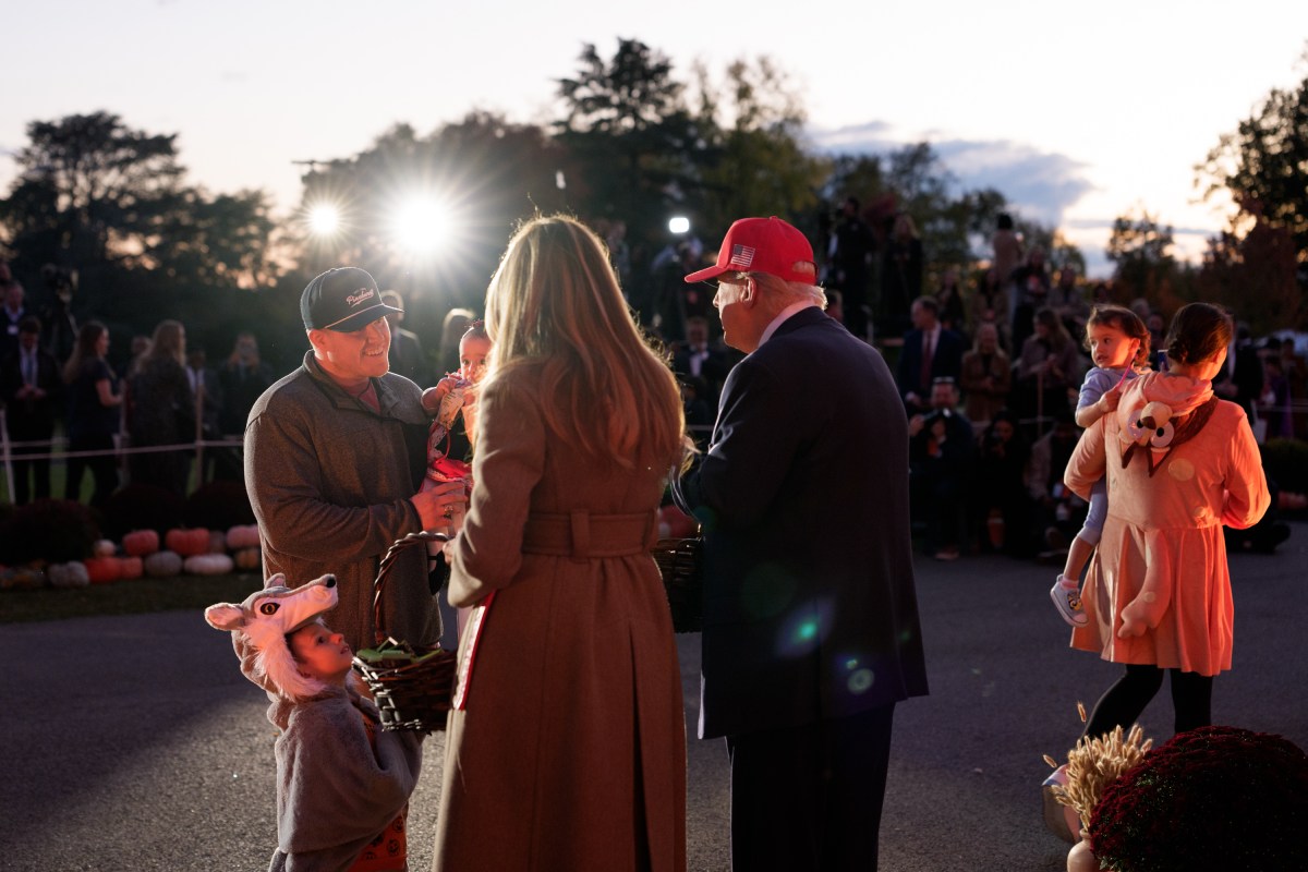 President Donald Trump and First Lady Melania Trump hand out candy to trick-or-treaters at the South Portico during Halloween celebrations at the White House, Thursday, October 30, 2025. (Official White House Photo by Andrea Hanks)