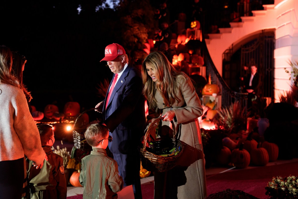 President Donald Trump and First Lady Melania Trump hand out candy to trick-or-treaters at the South Portico during Halloween celebrations at the White House, Thursday, October 30, 2025. (Official White House Photo by Andrea Hanks)
