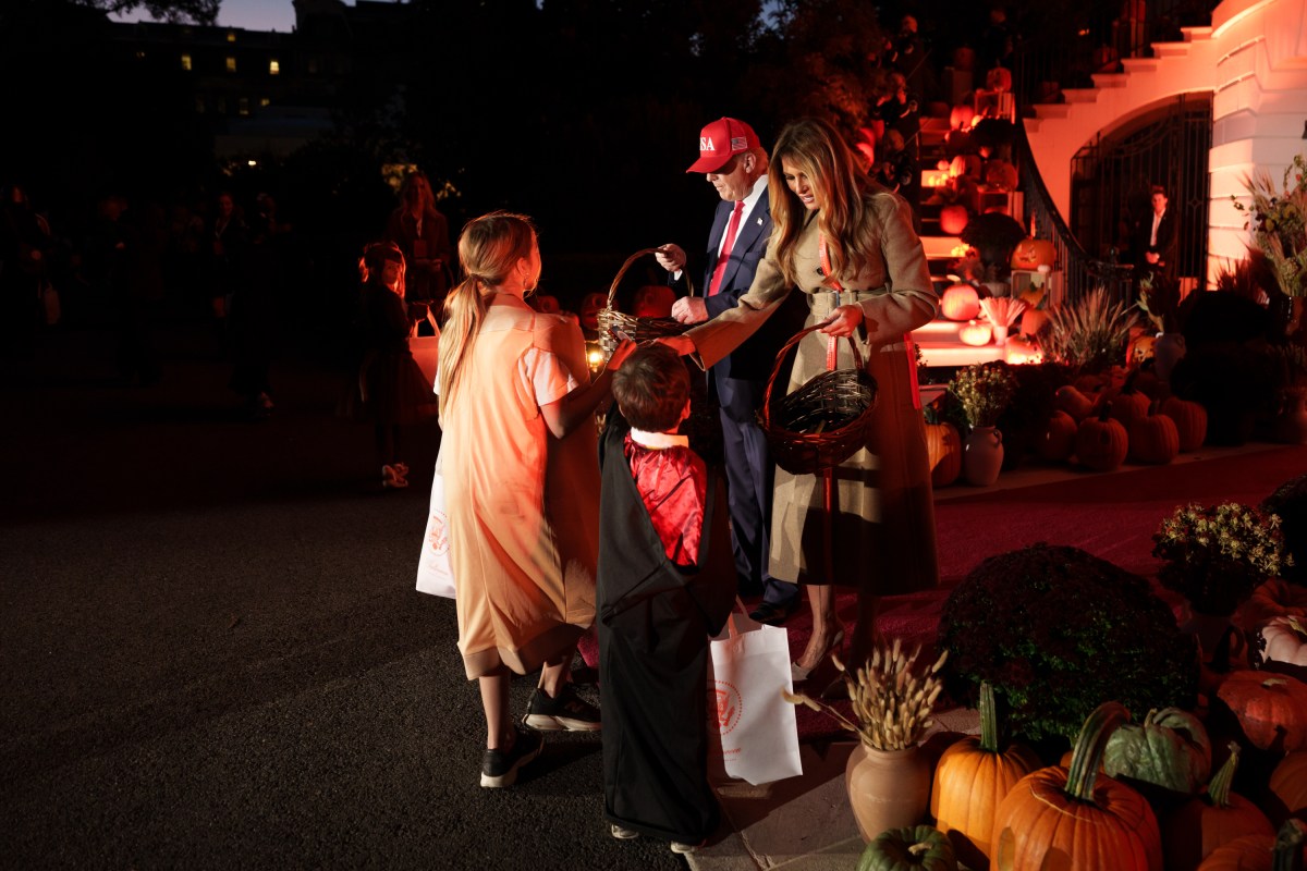 President Donald Trump and First Lady Melania Trump hand out candy to trick-or-treaters at the South Portico during Halloween celebrations at the White House, Thursday, October 30, 2025. (Official White House Photo by Andrea Hanks)