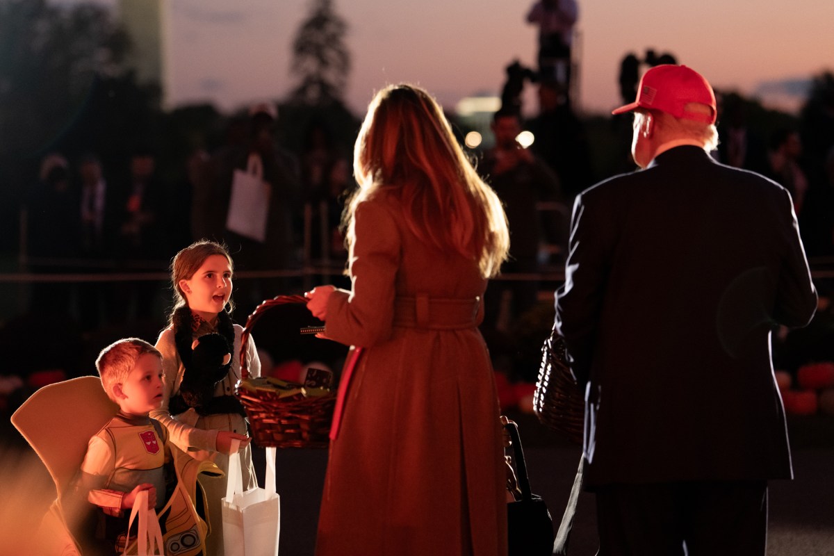 President Donald Trump and First Lady Melania Trump hand out candy to trick-or-treaters at the South Portico during Halloween celebrations at the White House, Thursday, October 30, 2025. (Official White House Photo by Andrea Hanks)