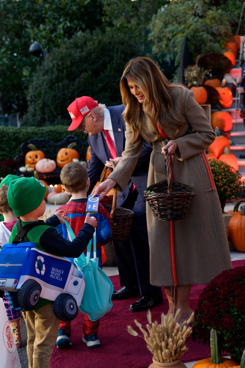 President Donald Trump and First Lady Melania Trump hand out candy to trick-or-treaters at the South Portico during Halloween celebrations at the White House, Thursday, October 30, 2025. (Official White House Photo by Andrea Hanks)