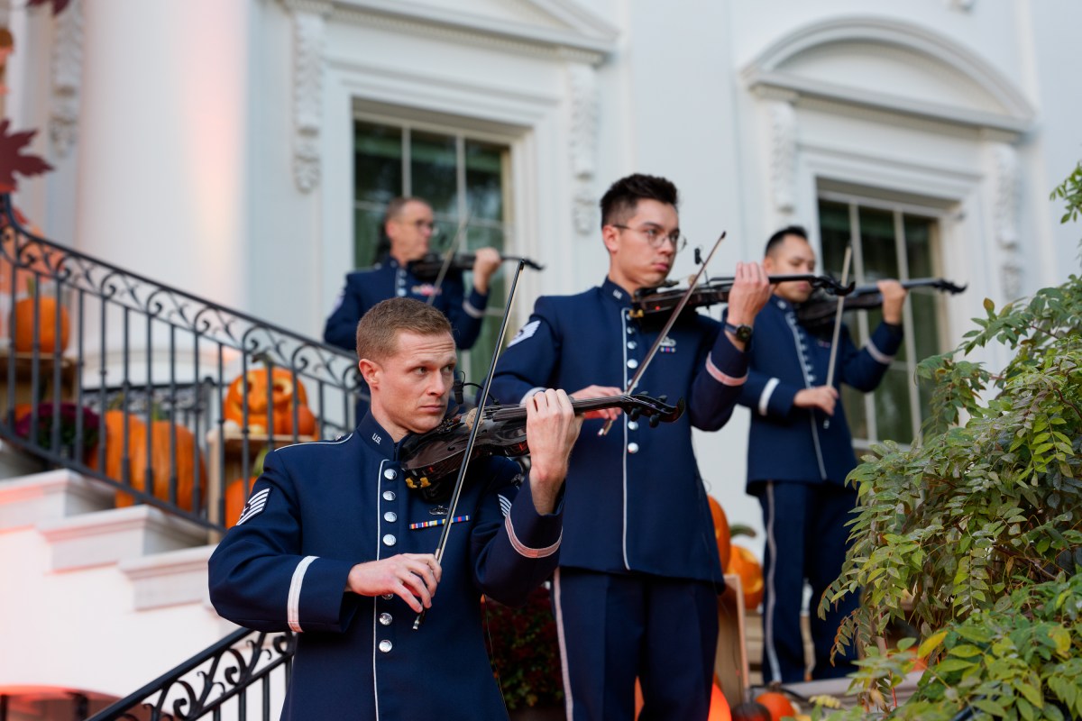 President Donald Trump and First Lady Melania Trump hand out candy to trick-or-treaters at the South Portico during Halloween celebrations at the White House, Thursday, October 30, 2025. (Official White House Photo by Andrea Hanks)
