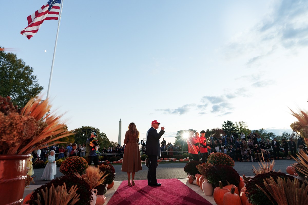 President Donald Trump and First Lady Melania Trump hand out candy to trick-or-treaters at the South Portico during Halloween celebrations at the White House, Thursday, October 30, 2025. (Official White House Photo by Andrea Hanks)