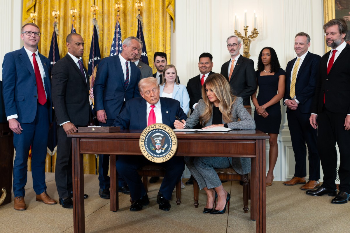 President Donald Trump signs a “Fostering the Future” executive order on foster care, Thursday, November 13, 2025, in the East Room of the White House. (Official White House Photo by Andrea Hanks)