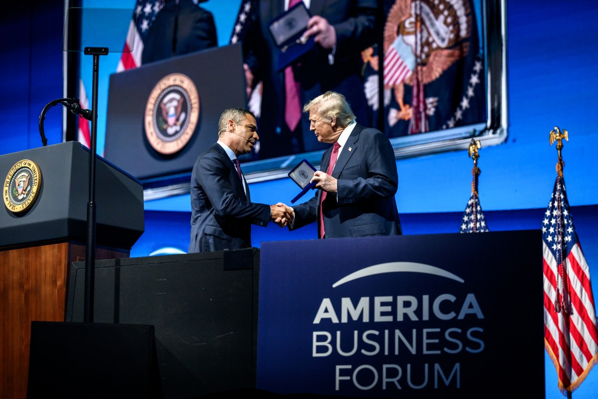President Donald Trump is presented the Key to the City of Miami by Mayor Francis Suarez at the America Business Forum Miami at the Kaseya Center in Miami, Florida, Wednesday, November 5, 2025. (Official White House Photo by Molly Riley)