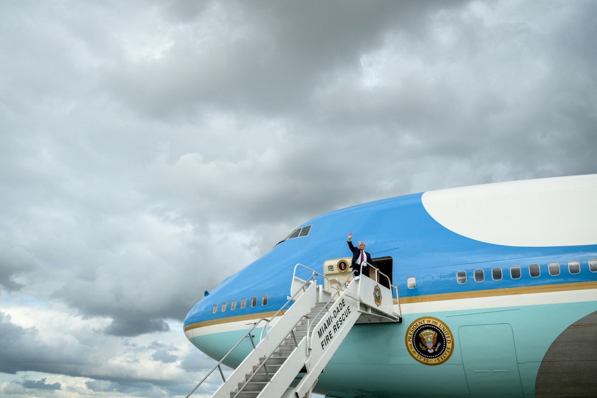 President Donald Trump waves to members of the media as he boards Air Force One at Miami International Airport, Wednesday, November 5, 2025. (Official White House Photo by Molly Riley)