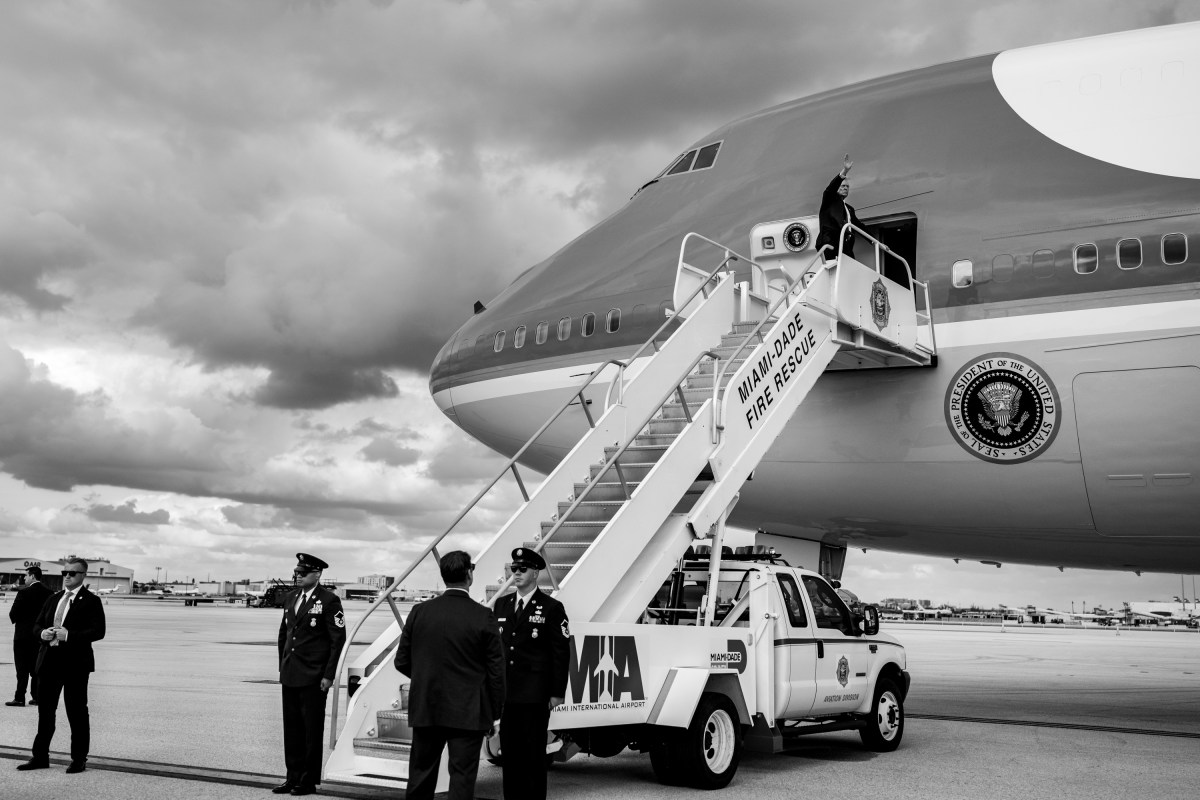 President Donald Trump waves to members of the media as he boards Air Force One at Miami International Airport, Wednesday, November 5, 2025. (Official White House Photo by Molly Riley)