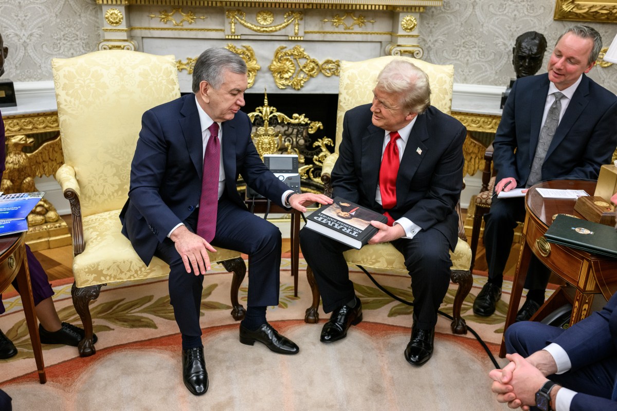 The President of the Republic of Uzbkeistan Shavkat Mirziyoyev presents President Donald Trump with a gift in the Oval Office before a dinner with other C5 Central Asian leaders, Thursday, November 6, 2025. (Official White House Photo by Daniel Torok)