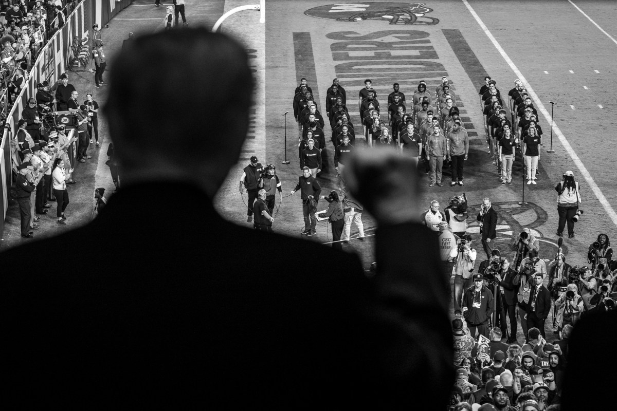President Donald Trump delivers the Oath of Enlistment alongside Secretary of War Pete Hegseth during a “Salute to Service” halftime ceremony honoring active-duty service members, veterans, and their families ahead of Veterans Day at Northwest Stadium in Landover, Maryland, Sunday, November 9, 2025. (Official White House Photo by Daniel Torok)